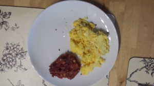 Fluffy scrambled eggs with thick tomato relish